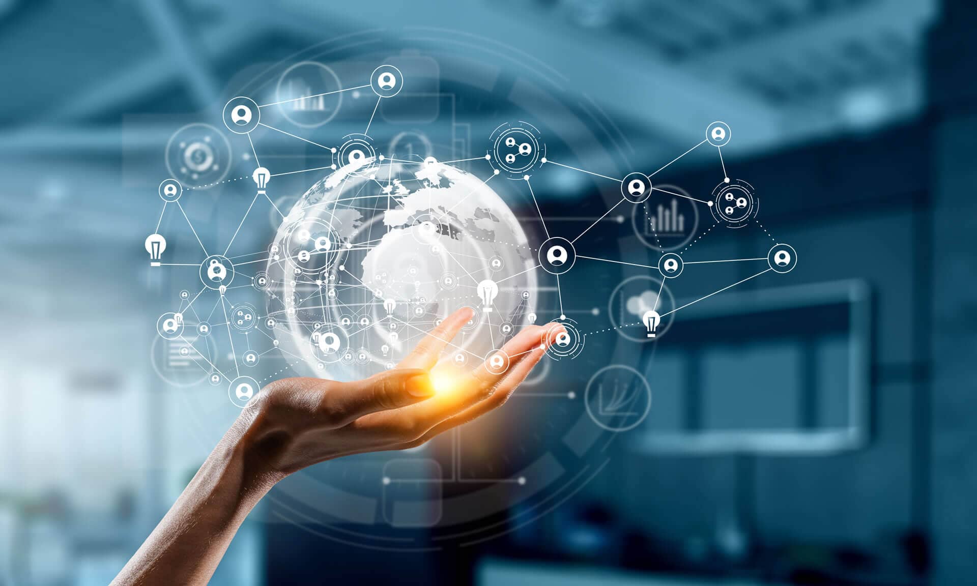 Hand holding a digital globe with interconnected network and technology icons symbolizing global communication.