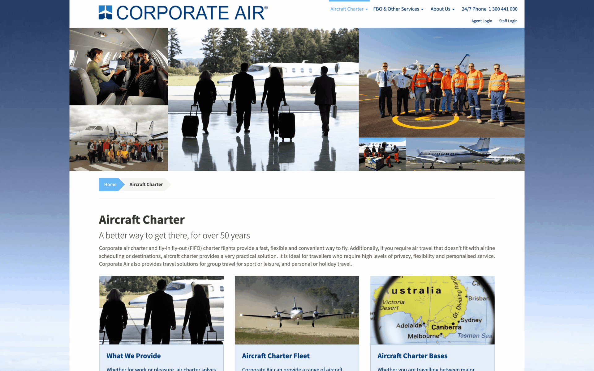 Business travelers walking with luggage toward a private jet at an airport hangar.