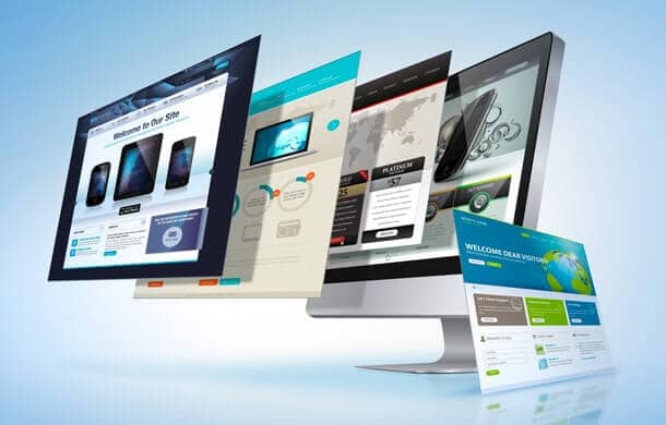 Multiple website pages displayed in a layered, floating perspective emerging from a computer monitor.