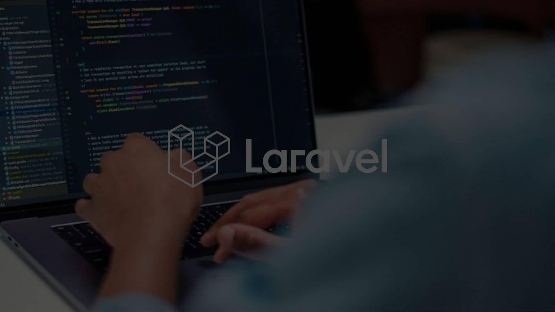 Person coding on laptop using Laravel website framework, preferred by OSKY for website development.