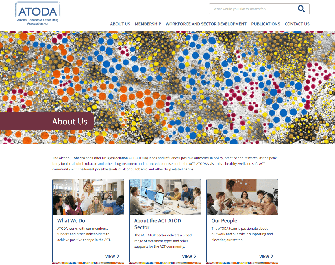 Website page of ATODA with navigation menu, colorful dotted banner, and sections about the organization and its people.