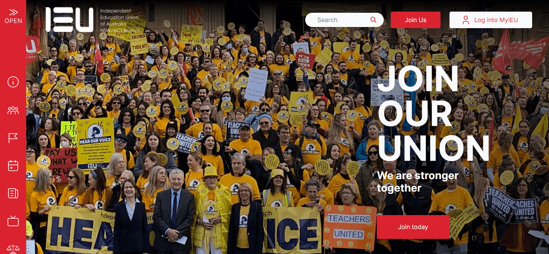 Crowd of people wearing yellow shirts holding signs at a union rally promoting strength together.